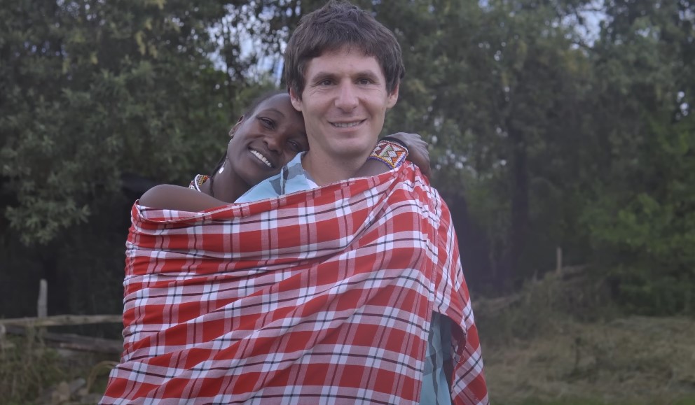 Couple connected by a checkered blanket