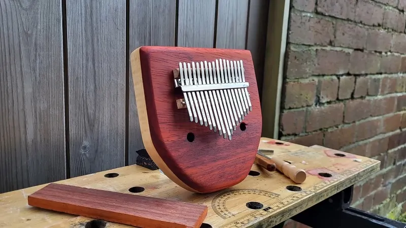 A handcrafted wooden mbira with metal tines