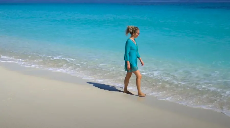 A woman strolls along the Tsarabanjina beach