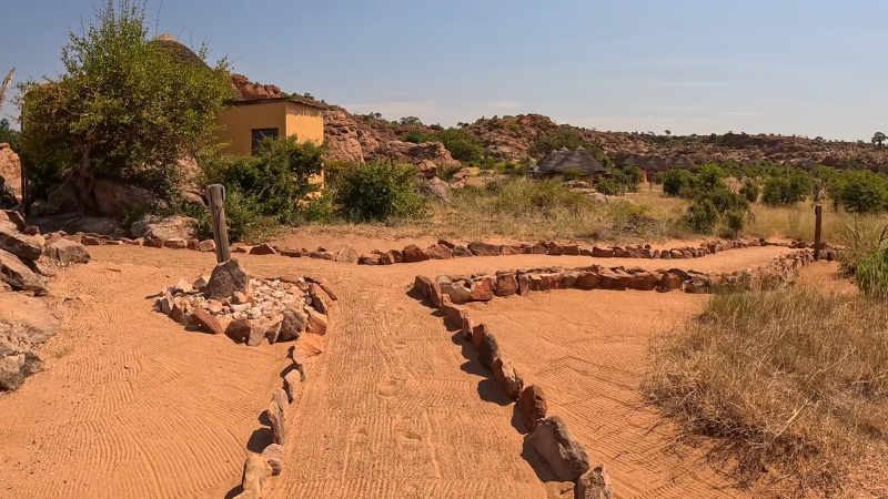 Archaeological remains at Mapungubwe with stone paths and surrounding dry landscape in South Africa