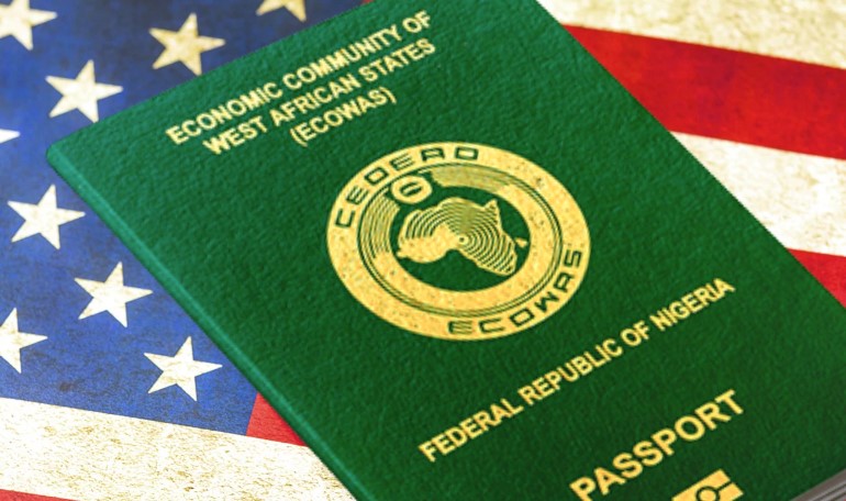 Nigerian passport on American flag background