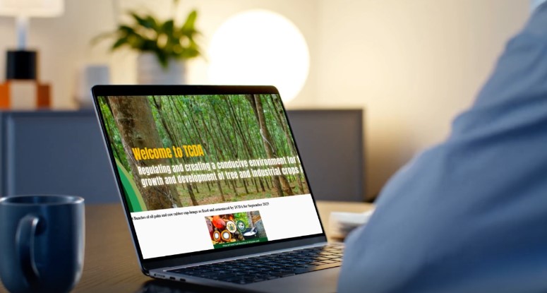 Laptop screen displaying a website with a forest backdrop and text about regulating and creating a conducive environment for industrial crops