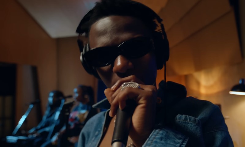 Wizkid singing while looking at the camera