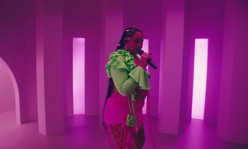 MOLIY singing in a music video