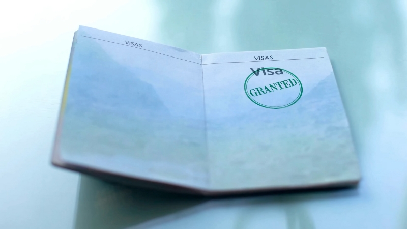 Open passport showing a visa stamp that reflects Schengen visa validity and allowed stay duration