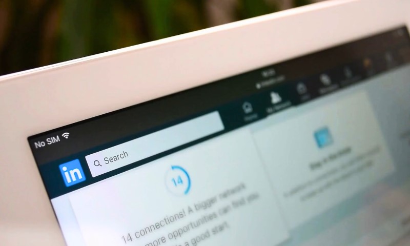 Close-up of a tablet screen showing the LinkedIn interface